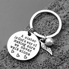 Load image into Gallery viewer, A Sister is God&#39;s Way of Making Sure We Never Walk Alone Keychain