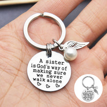 Load image into Gallery viewer, A Sister is God&#39;s Way of Making Sure We Never Walk Alone Keychain